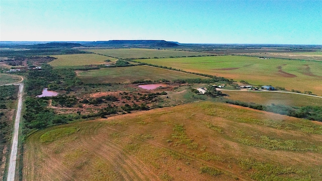 birds eye view of property with a rural view