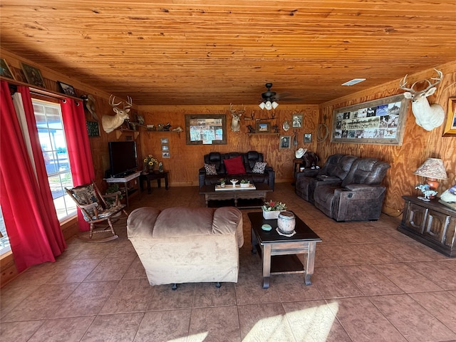 tiled living room with wooden walls, ceiling fan, and wooden ceiling