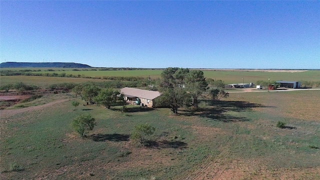 aerial view with a mountain view and a rural view