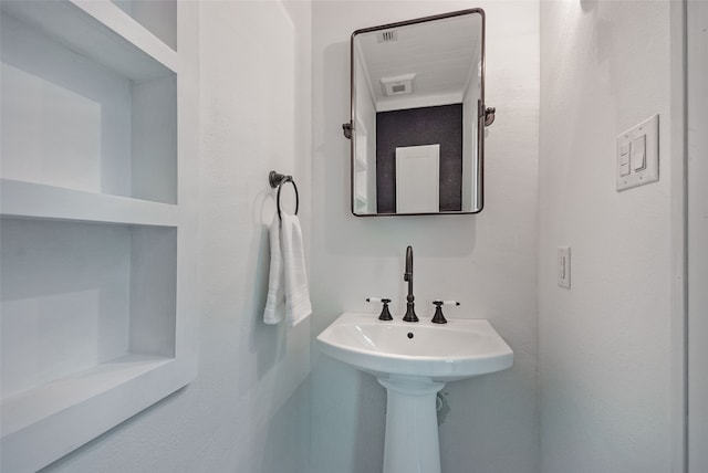 bathroom featuring built in shelves