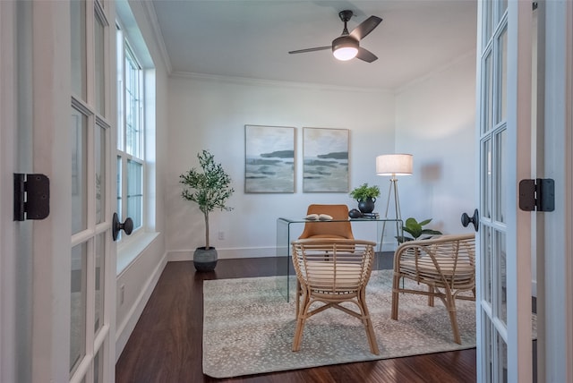 sitting room with ceiling fan, dark hardwood / wood-style flooring, ornamental molding, and french doors