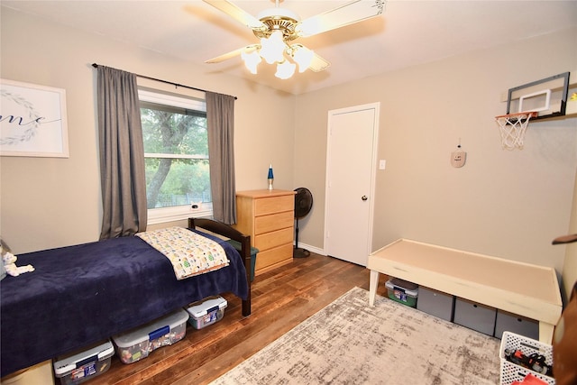 bedroom featuring dark hardwood / wood-style floors and ceiling fan