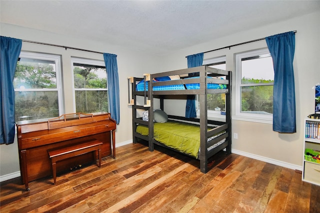 bedroom with hardwood / wood-style floors