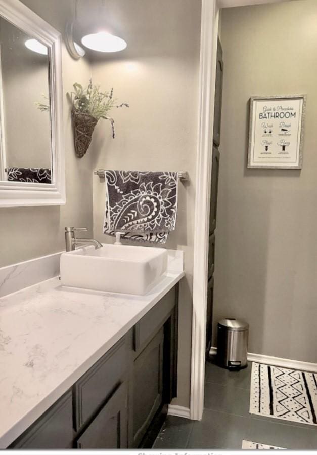 bathroom with vanity and tile patterned floors