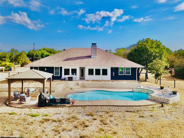 view of swimming pool with outdoor lounge area, a gazebo, and a patio