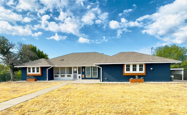 single story home with a front yard