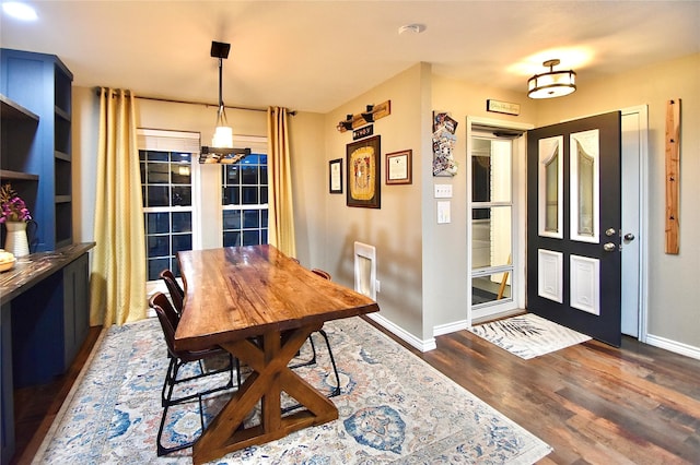 dining area with dark hardwood / wood-style floors