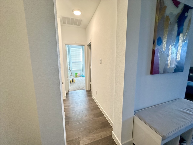 corridor with dark wood-type flooring