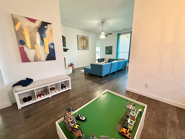 rec room featuring dark hardwood / wood-style floors and ceiling fan