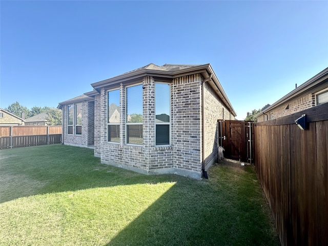 view of property exterior featuring a yard