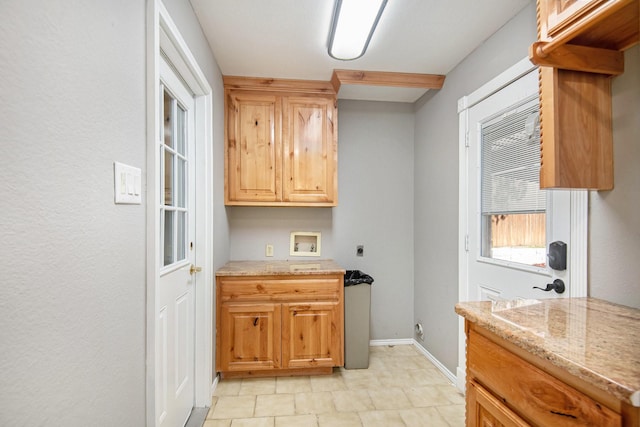 kitchen featuring light stone counters