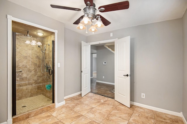 bathroom featuring ceiling fan and walk in shower