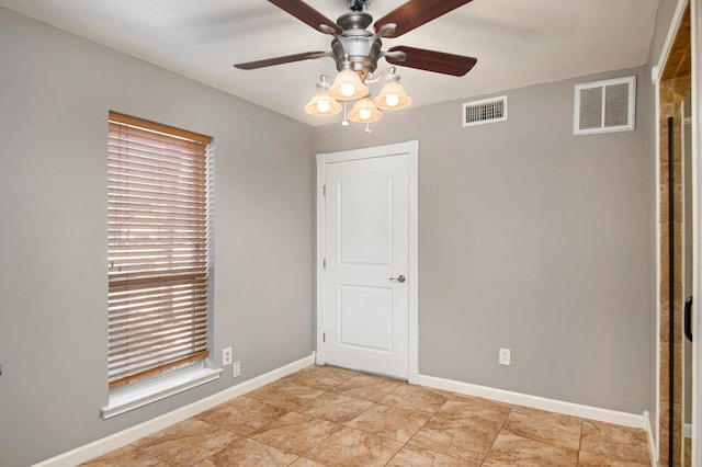 unfurnished room featuring ceiling fan