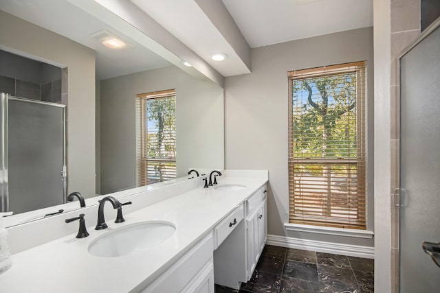 bathroom with vanity and an enclosed shower