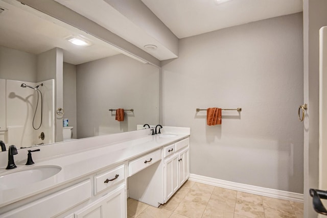 bathroom with vanity, toilet, and walk in shower