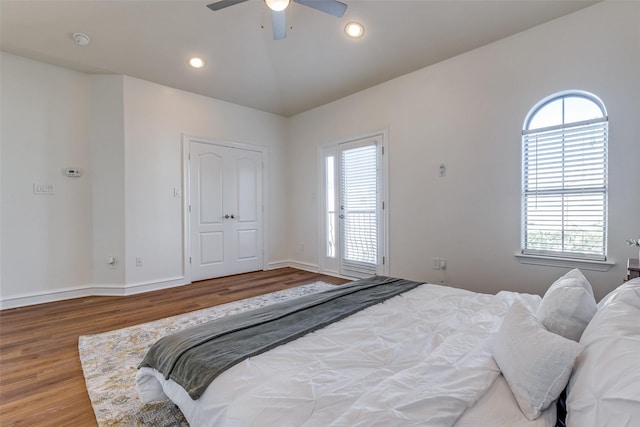 bedroom featuring hardwood / wood-style flooring and ceiling fan