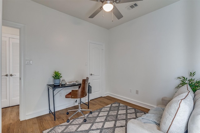 office space featuring hardwood / wood-style floors and ceiling fan