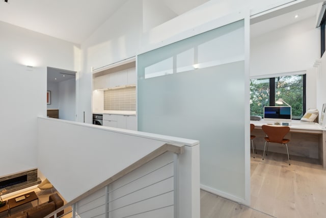 5103 Vickery Blvd, Dallas, TX 75206 - hall with high vaulted ceiling, light wood-style flooring, an office area, recessed lighting, and baseboards