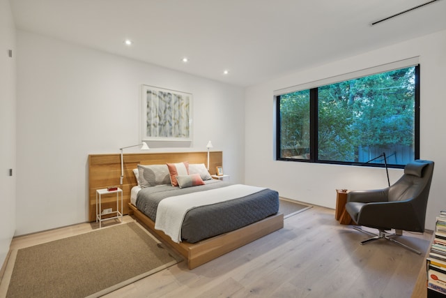 bedroom with light wood-type flooring