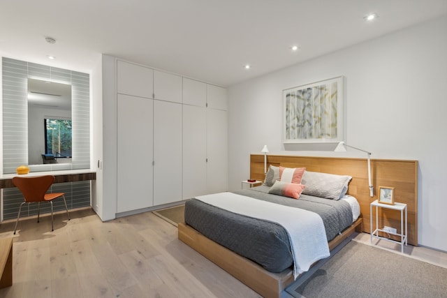 bedroom with light hardwood / wood-style floors