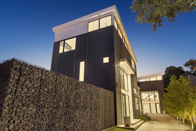 view of property exterior at dusk