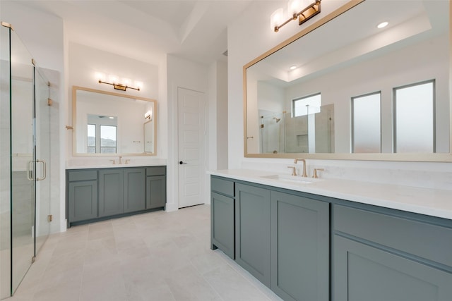 bathroom featuring vanity, tile patterned flooring, and a shower with shower door