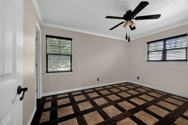 spare room with ceiling fan and crown molding