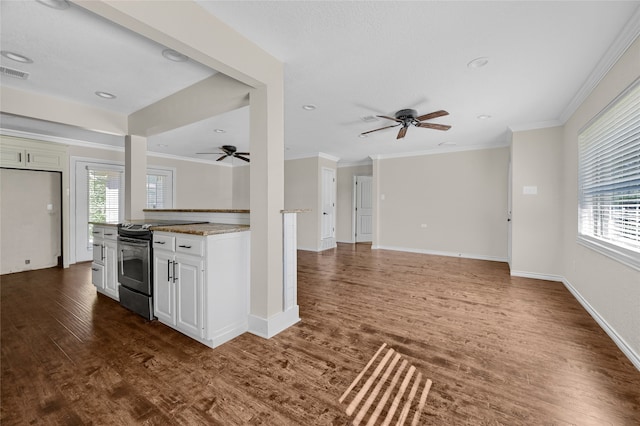 kitchen featuring a wealth of natural light, white cabinetry, dark wood-type flooring, and black / electric stove