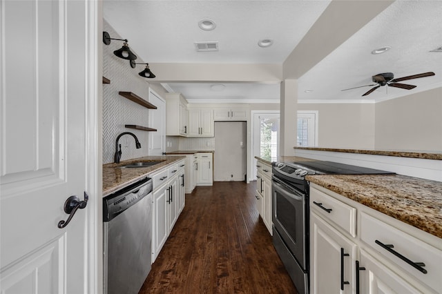 kitchen with dark wood-type flooring, crown molding, light stone countertops, white cabinetry, and stainless steel appliances