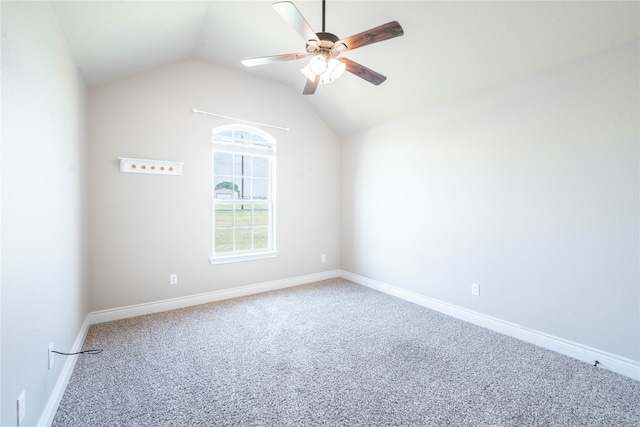 carpeted empty room featuring ceiling fan and vaulted ceiling