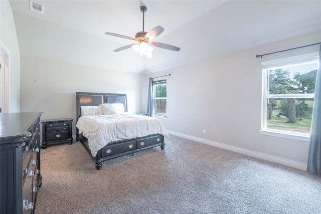 carpeted bedroom featuring ceiling fan and lofted ceiling