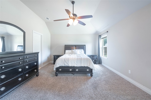 bedroom featuring ceiling fan, carpet floors, and vaulted ceiling