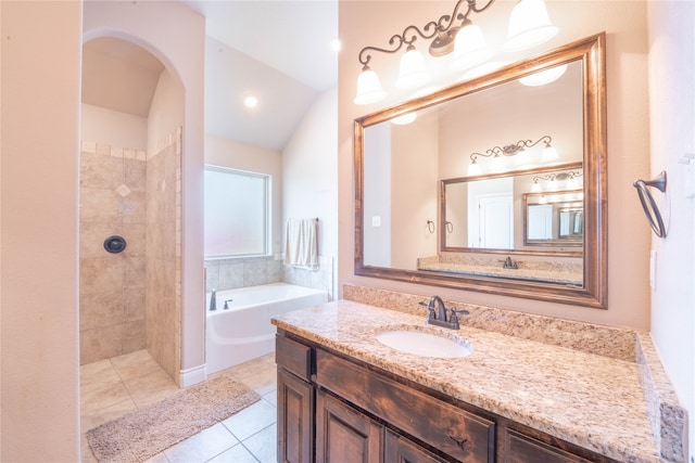 bathroom with a bath, tile patterned floors, vanity, and vaulted ceiling