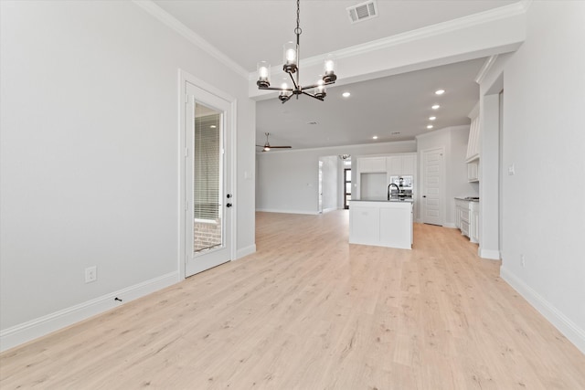 unfurnished living room featuring sink, ornamental molding, ceiling fan with notable chandelier, and light wood-type flooring