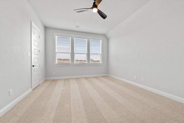 unfurnished room featuring light carpet, ceiling fan, and lofted ceiling