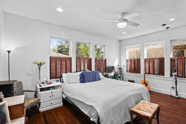 bedroom featuring ceiling fan and dark hardwood / wood-style flooring