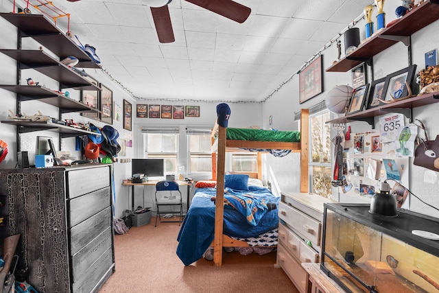 bedroom featuring ceiling fan and carpet floors