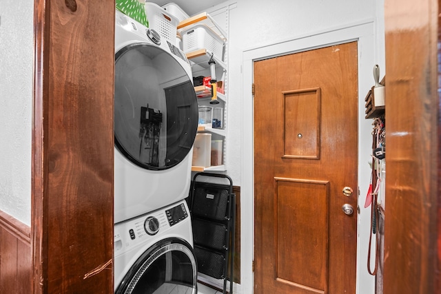 laundry area with stacked washer / dryer