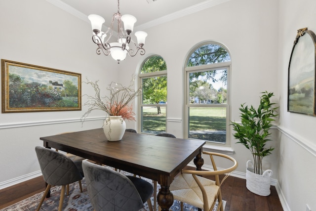 dining room featuring a chandelier, dark hardwood / wood-style floors, and ornamental molding