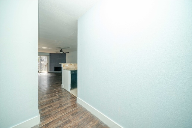 hall with dark wood-type flooring