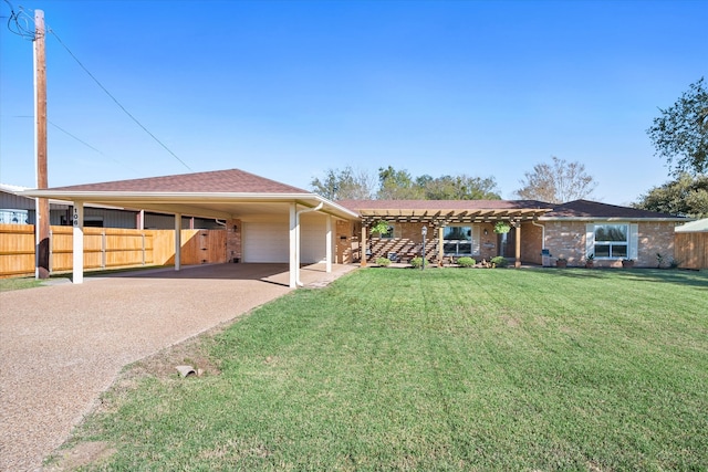 view of front of home featuring a carport, a garage, and a front yard