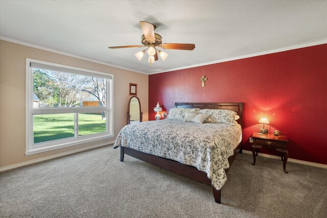 bedroom featuring ceiling fan, carpet floors, and crown molding
