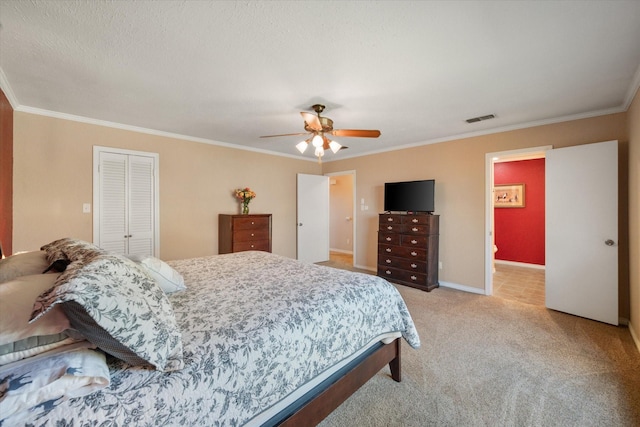 106 Coke St, Streetman, TX 75859 - bedroom with ornamental molding, light colored carpet, a closet, a ceiling fan, and baseboards