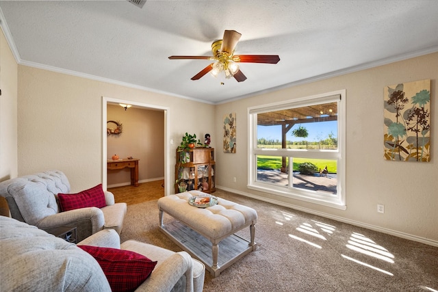 carpeted living room with a textured ceiling, ceiling fan, and ornamental molding