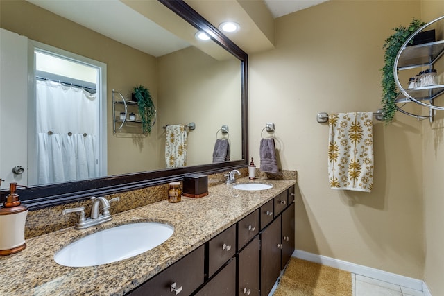 bathroom featuring tile patterned floors and vanity