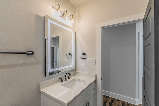 bathroom with wood-type flooring and vanity