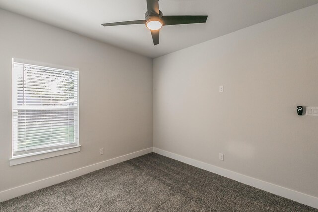 empty room featuring carpet flooring and ceiling fan