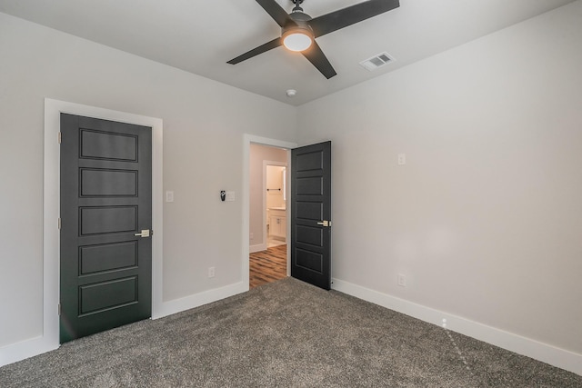 unfurnished bedroom featuring ceiling fan and carpet flooring