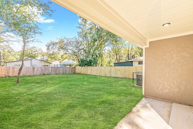 view of yard featuring central AC