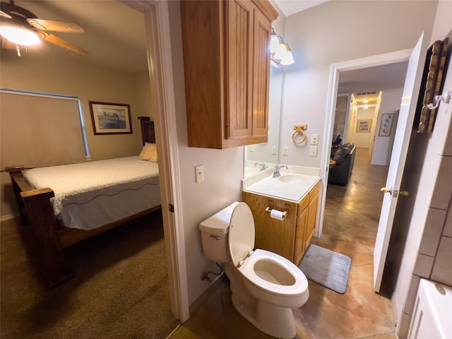 bathroom with vanity, toilet, and ceiling fan